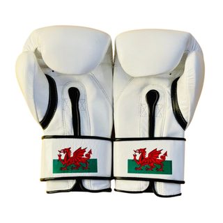 white leather boxing gloves with black trim, velcro strap, and Welsh flag accent