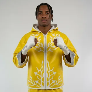 Custom boxing jacket in yellow leatherette with white metallic trim and crystals
