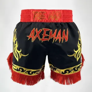 Custom Muay Thai shorts in black satin with gold shine trim and red fringe