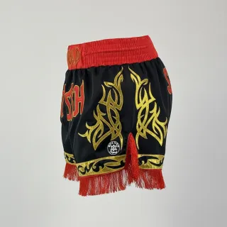 Custom Muay Thai shorts in black satin with gold shine trim and red fringe