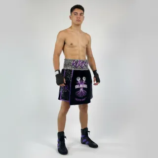 Custom boxing shorts in green high-shine satin with snake print waistband and flag detail