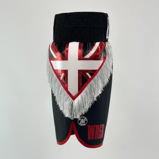 custom boxing shorts in black satin with Union Jack flag panel and white tassel trim