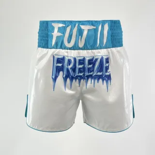 Custom Muay Thai shorts front view in white high shine with light blue satin and Classic design logo embroidery