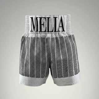 Custom boxing shorts in white satin with black print, quilted panels and crystal name waistband