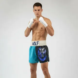 Custom Muay Thai shorts in aqua matt satin with wolf print and embroidered waistband name