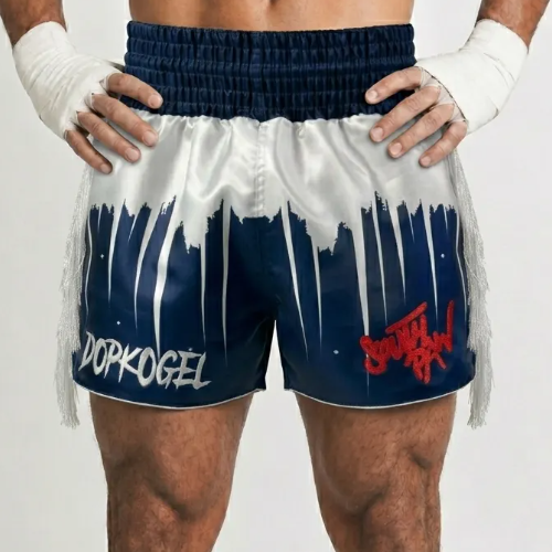 Shine Bright custom Muay Thai shorts with striking drip-effect pattern, wide legs, and side slits.