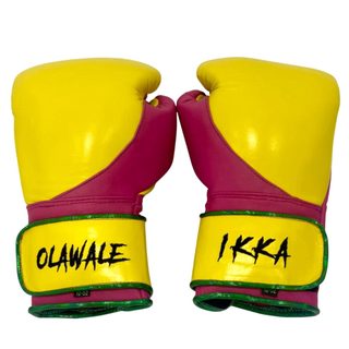 QuickFire Max yellow engineered leatherette boxing gloves with light purple and green leatherette details and secure Velcro wrist closure.