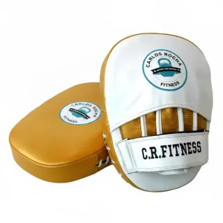 Custom boxing focus pad in white glove leather with yellow gold metallic leather accents and curved striking surface