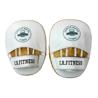 Custom boxing focus pad in white glove leather with yellow gold metallic leather accents and curved striking surface