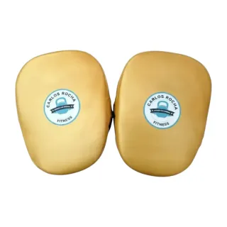 Custom boxing focus pad in white glove leather with yellow gold metallic leather accents and curved striking surface