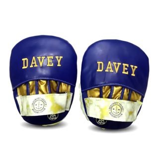 Custom boxing focus pad in navy blue glossy leatherette with gold metallic accents and white-gold marble detailing